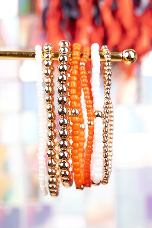 Bangles with bold onyx stones for contrast -Expect Victory Orange and White Beaded Bracelet Set