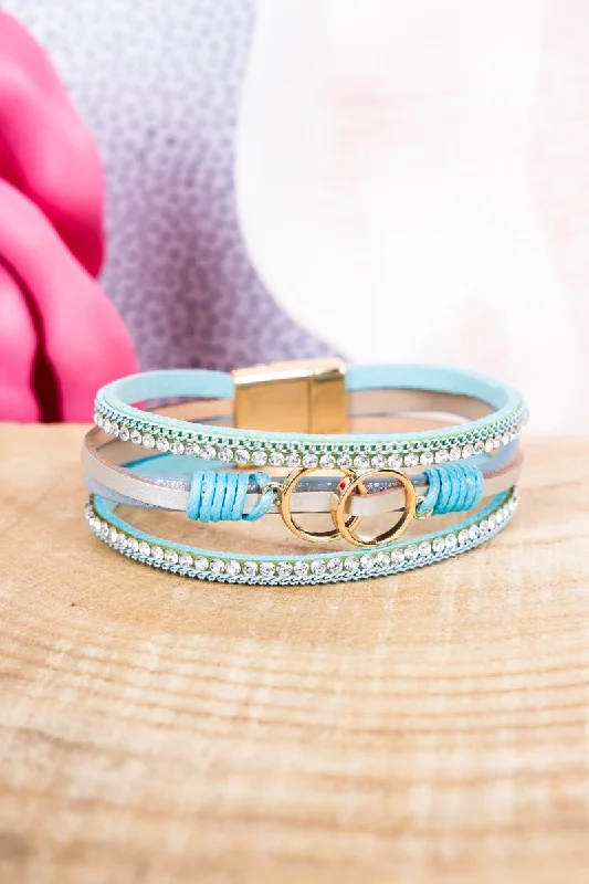 Silver bangles featuring vibrant turquoise stone inlays -Viola Blue Infiniti Goldtone Multi-Strand Magnetic Bracelet