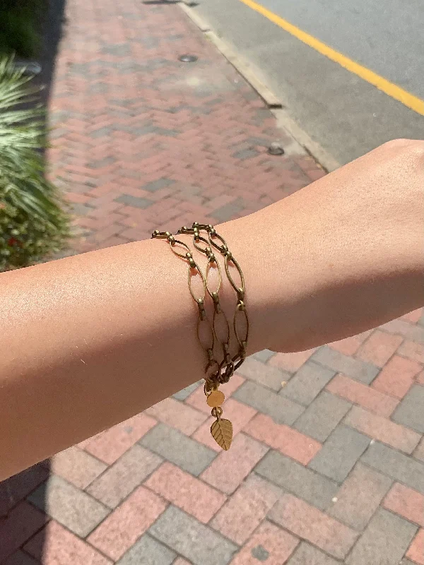 Bangles with raw sapphire for rugged chic -The Triple Strand Oxidized Brass Chain Bracelet