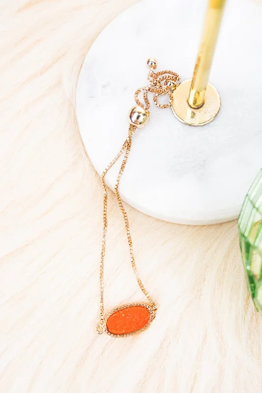 Bracelets with wave engravings for ocean vibes -Crystal Avenue Worn Goldtone and Tangerine Druzy Adjustable Bracelet