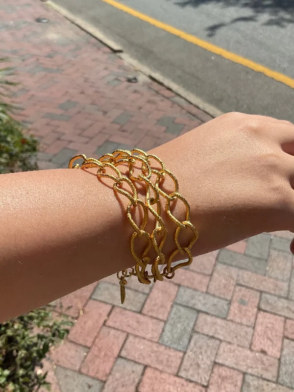 Bracelets with polished coral for vibrant shine -The Triple Chain Gold Chain Bracelet